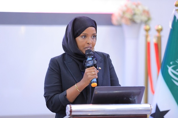 Woman speaks at a microphone at the launch of the first-ever Gender Department in Somaliland Parliament